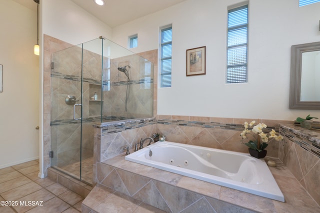 bathroom featuring recessed lighting, tile patterned floors, a shower stall, and a jetted tub