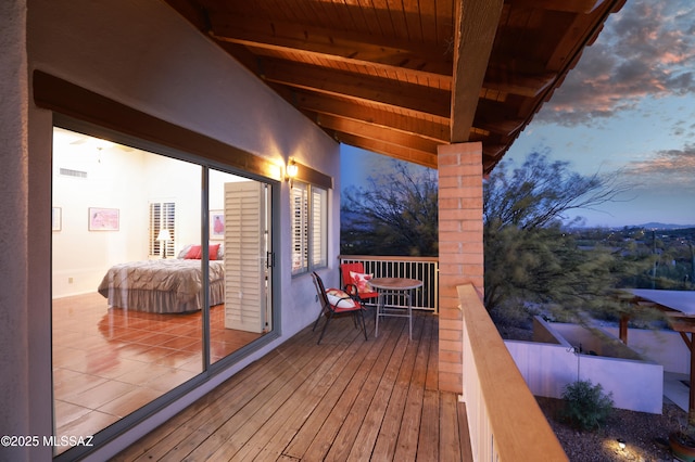 wooden deck featuring visible vents