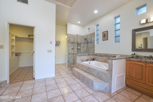 full bathroom featuring a garden tub, visible vents, a shower stall, vanity, and tile patterned flooring