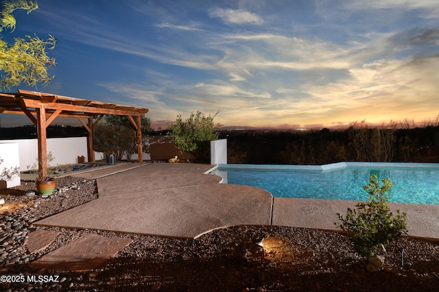 view of swimming pool with a pergola, an infinity pool, and a patio area