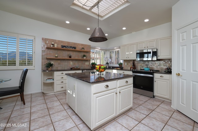 kitchen featuring a center island, open shelves, stainless steel microwave, electric range oven, and light tile patterned flooring