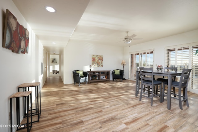 dining area with ceiling fan, recessed lighting, and light wood-style floors