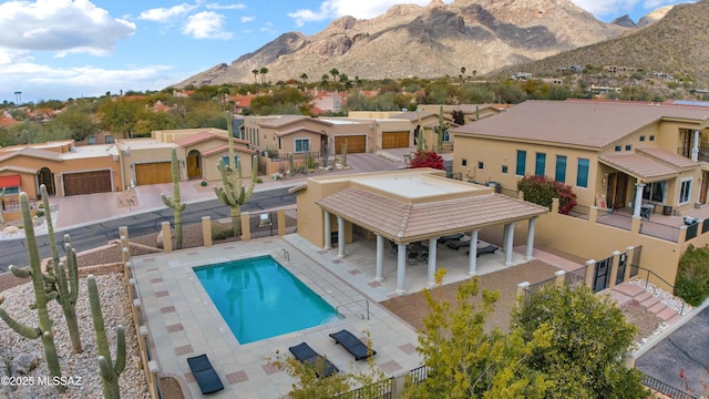 exterior space featuring a mountain view and a patio area