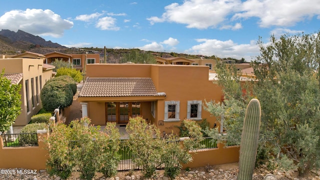 back of property featuring a mountain view