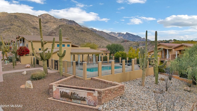 view of pool with a mountain view and a patio