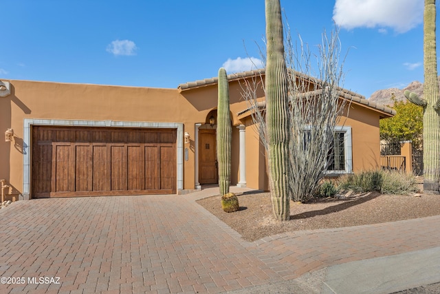 view of front of property featuring a garage