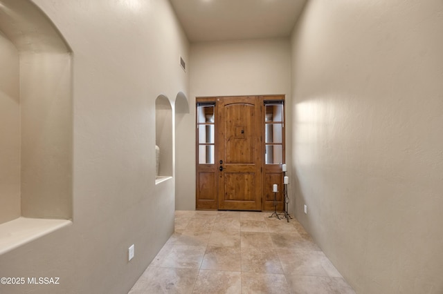 doorway featuring light tile patterned floors