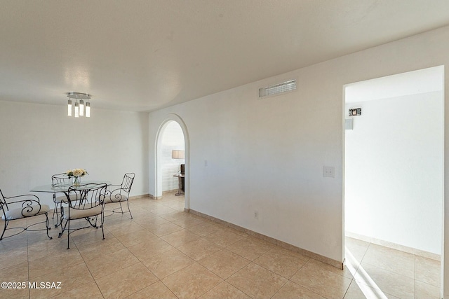 dining space featuring light tile patterned floors