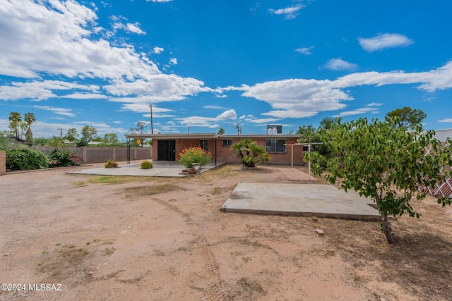 rear view of house with a patio