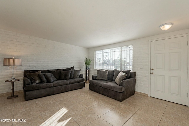 tiled living room with brick wall