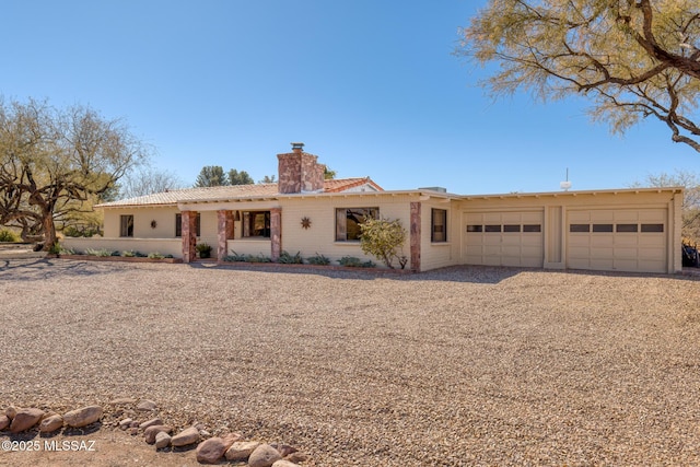 single story home featuring a garage