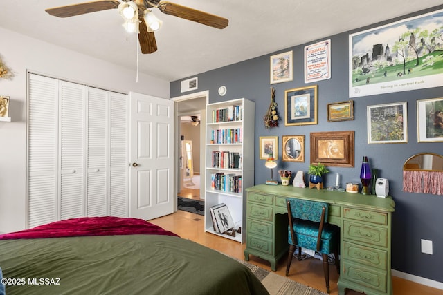 bedroom featuring ceiling fan and a closet