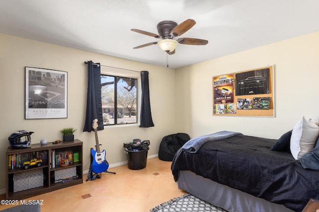 tiled bedroom with ceiling fan