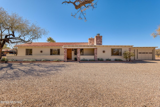 single story home with a garage