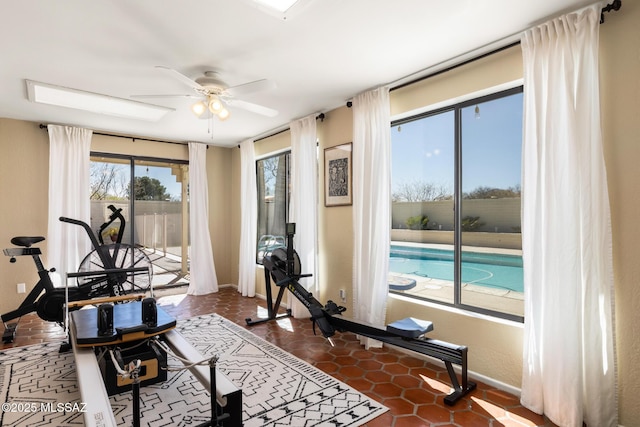 workout room featuring ceiling fan