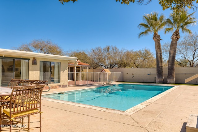 view of swimming pool with a patio