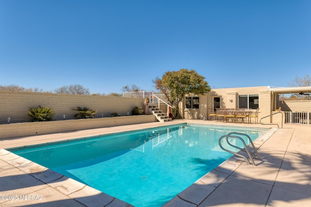 view of pool featuring a patio