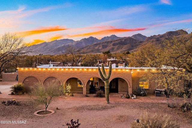 view of front facade featuring a porch and a mountain view