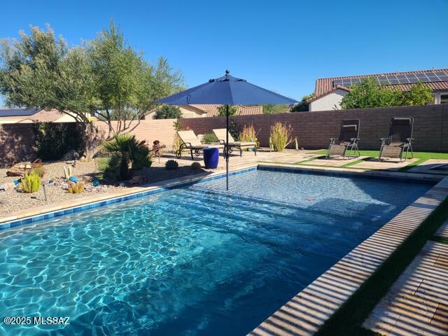 view of pool featuring a patio area