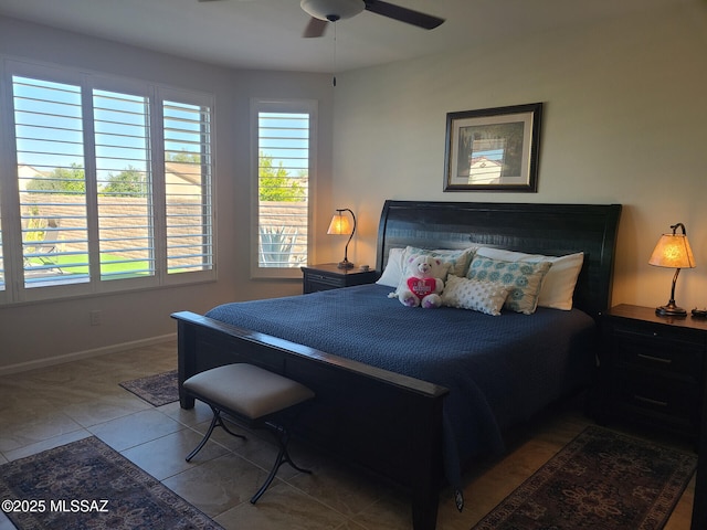 bedroom with ceiling fan and light tile patterned floors