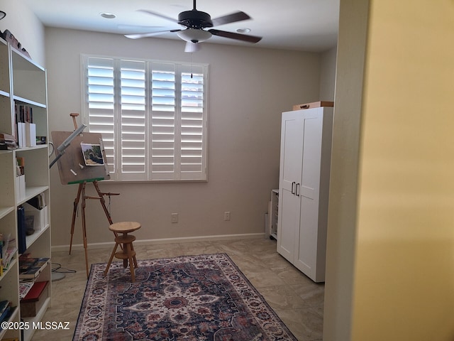 interior space featuring ceiling fan