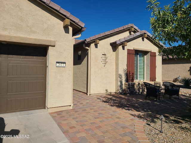 view of patio / terrace with a garage