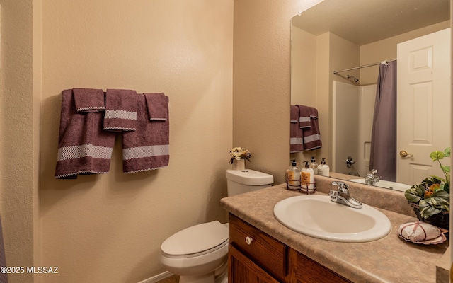 8497 E Hodgman Pl, Tucson, AZ 85747 - bathroom featuring vanity, toilet, curtained shower, and a textured wall
