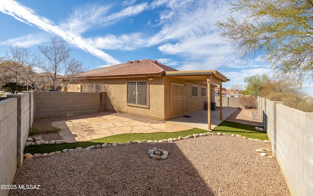 8497 E Hodgman Pl, Tucson, AZ 85747 - back of house with a patio, a fenced backyard, stucco siding, and a tiled roof