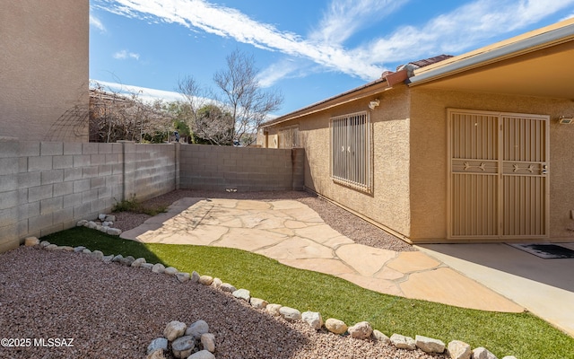 8497 E Hodgman Pl, Tucson, AZ 85747 - fenced backyard with a patio