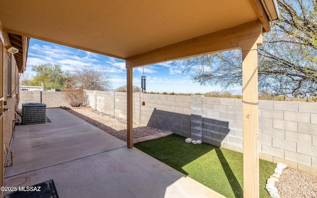 8497 E Hodgman Pl, Tucson, AZ 85747 - fenced backyard with a patio area and cooling unit