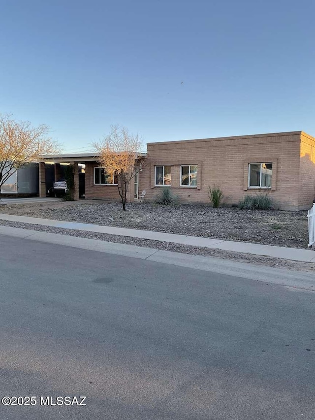 ranch-style house with a carport