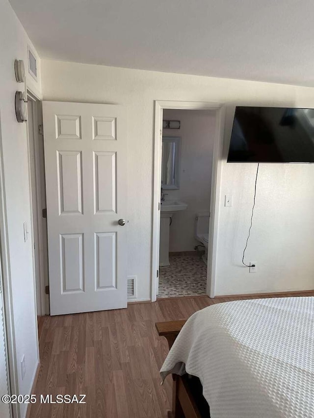 bedroom featuring hardwood / wood-style floors