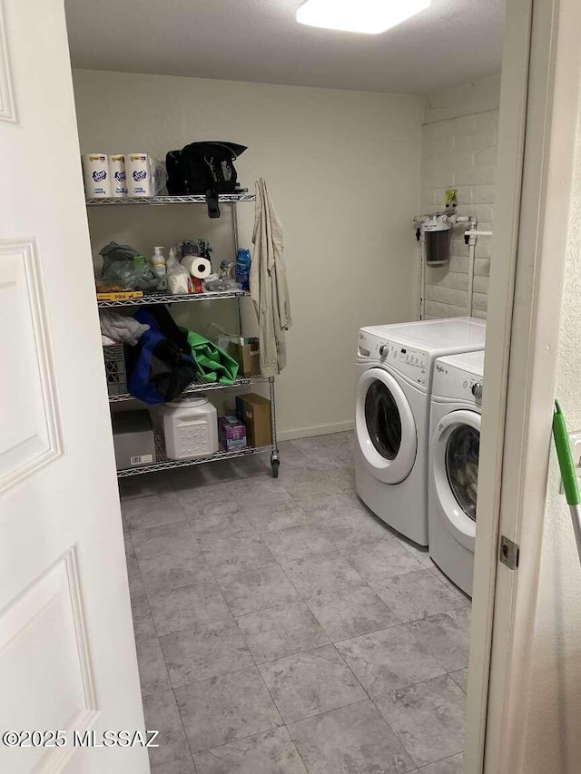 washroom with separate washer and dryer