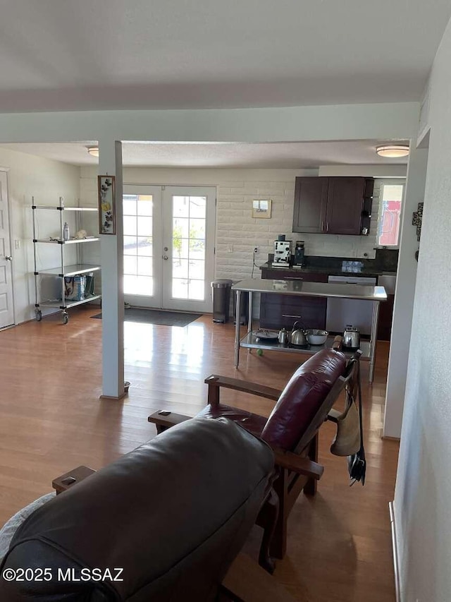 living room with french doors and light hardwood / wood-style flooring