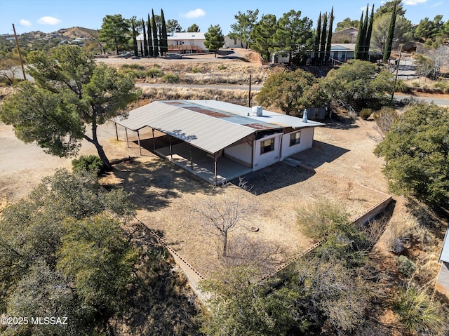 birds eye view of property with a mountain view