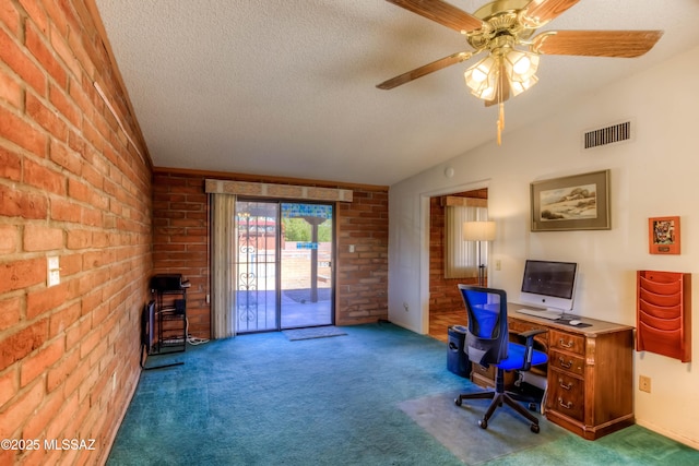 office space featuring lofted ceiling, visible vents, carpet flooring, and a textured ceiling