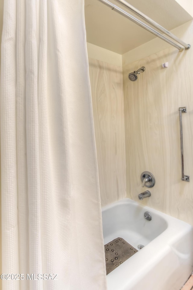 bathroom featuring shower / tub combo with curtain