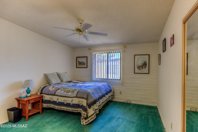 carpeted bedroom featuring a ceiling fan and a textured ceiling