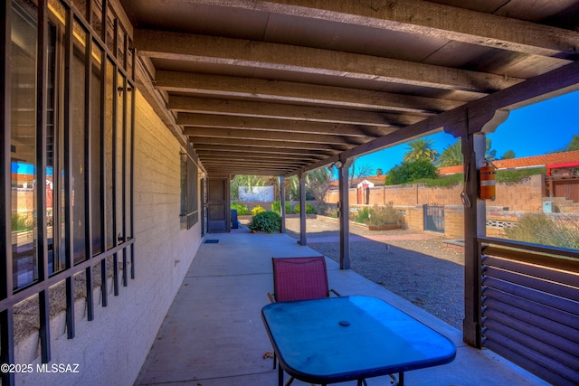 view of patio featuring fence