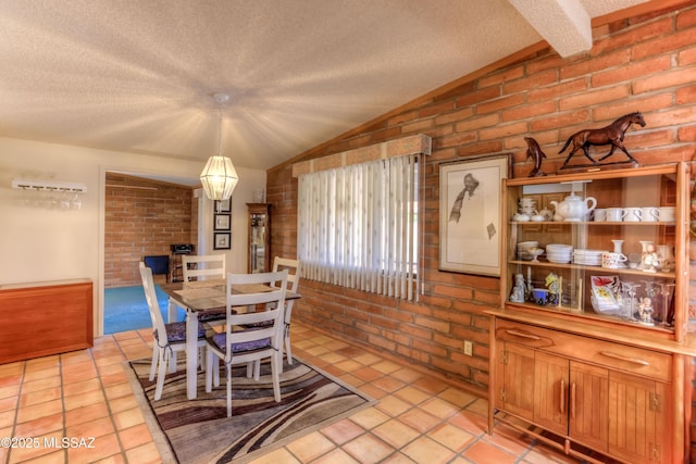 dining room with vaulted ceiling with beams, brick wall, a chandelier, and a textured ceiling