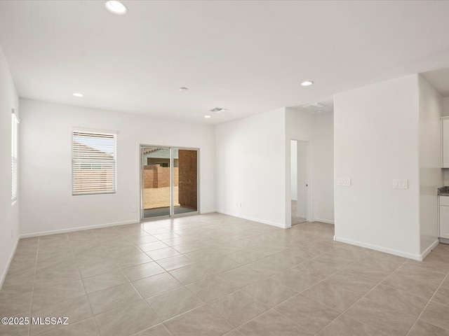 unfurnished room featuring recessed lighting, visible vents, baseboards, and light tile patterned flooring