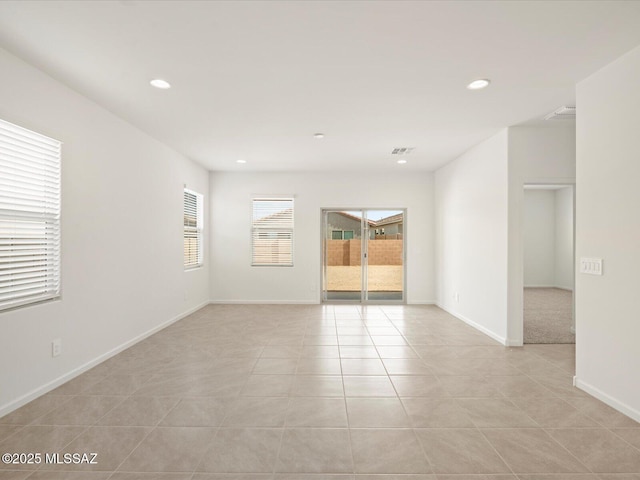 spare room featuring visible vents, light tile patterned flooring, recessed lighting, and baseboards