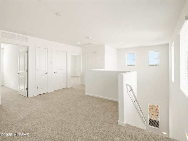 interior space featuring baseboards and visible vents