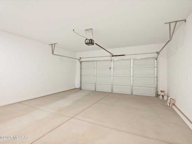 garage featuring baseboards and a garage door opener