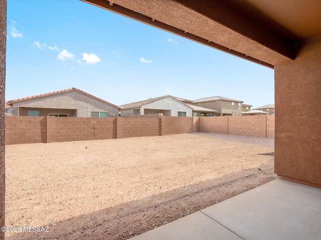 view of yard featuring a patio and a fenced backyard