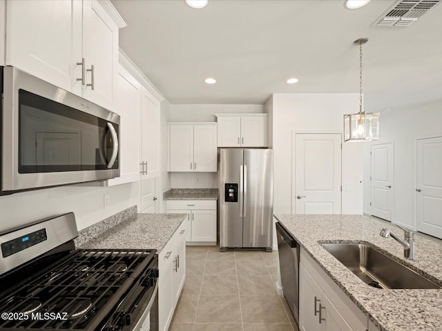 kitchen featuring a sink, visible vents, appliances with stainless steel finishes, and white cabinetry