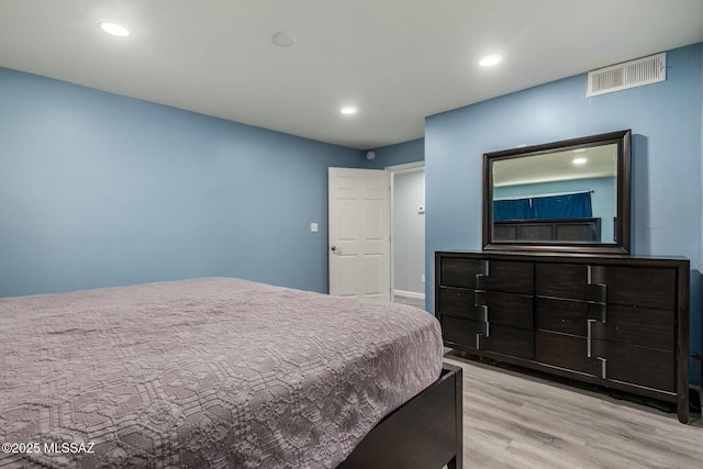 bedroom with light hardwood / wood-style flooring