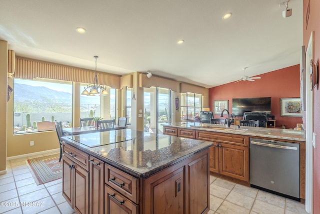 kitchen featuring lofted ceiling, a sink, open floor plan, brown cabinets, and dishwasher