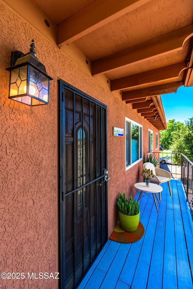 entrance to property featuring a balcony