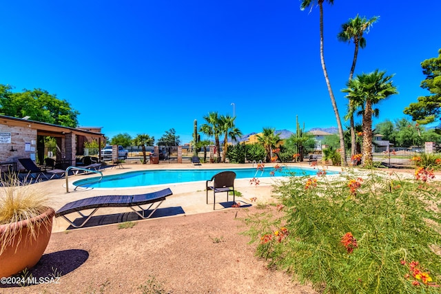 view of swimming pool featuring a patio area